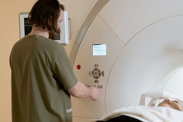 man operating an MRI machine